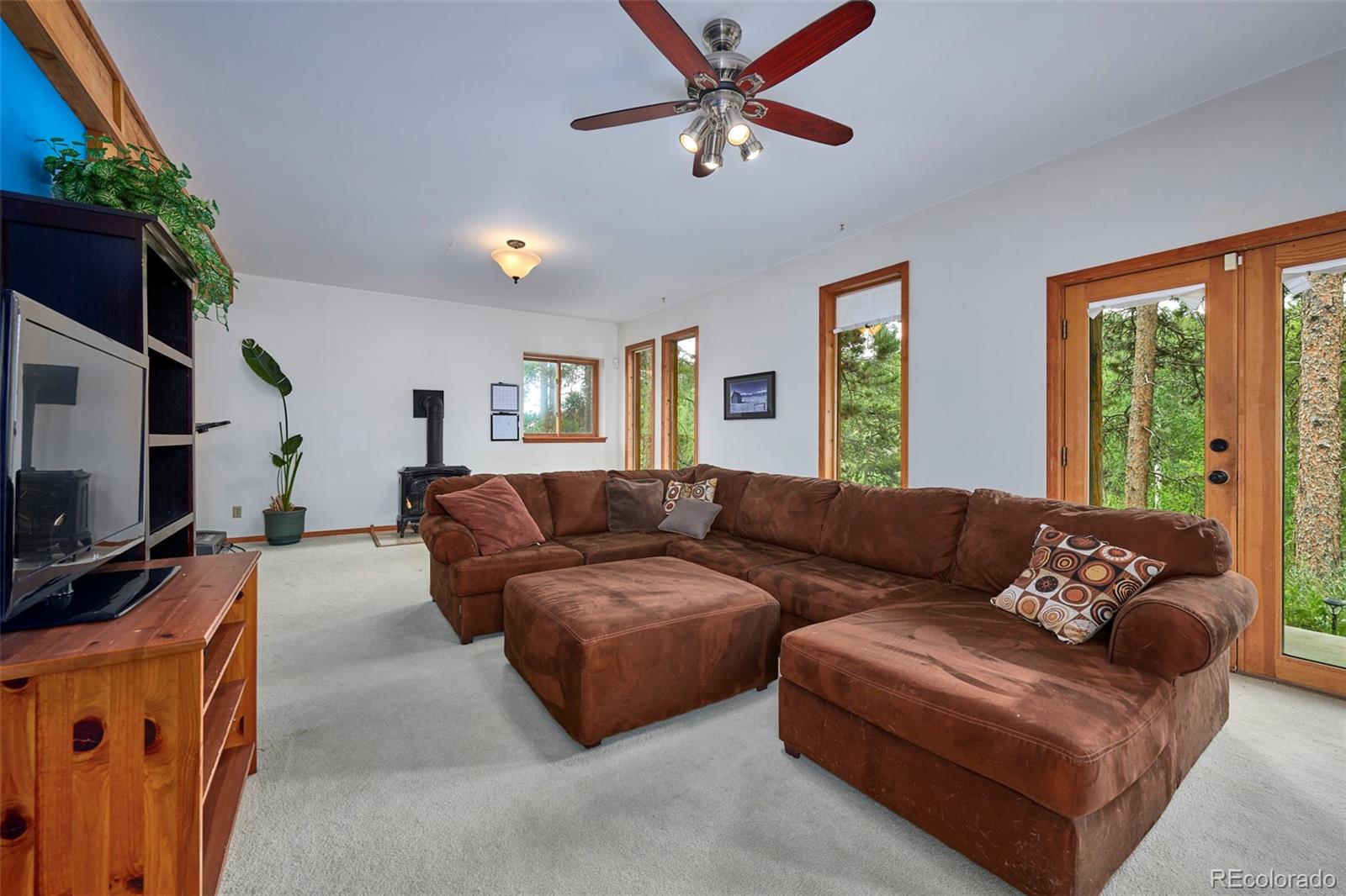 11838 Ridge Road Golden, CO 80403 - Photo 20 of 35 a living room with furniture and a flat screen tv