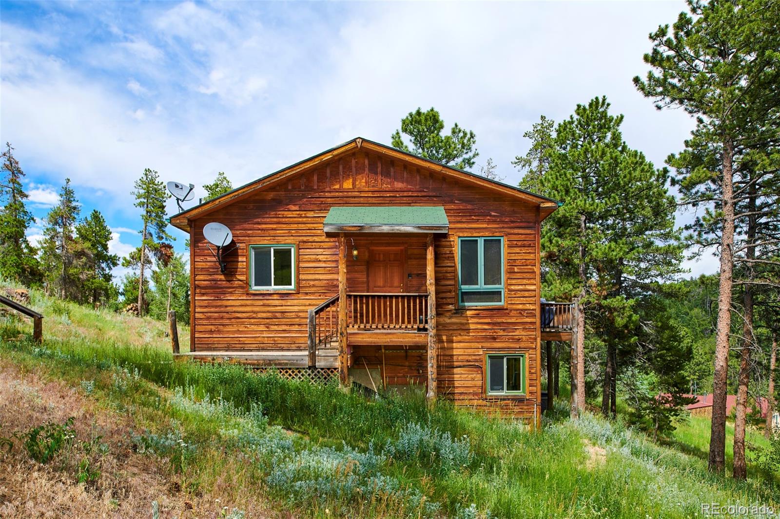 11838 Ridge Road Golden, CO 80403 - Photo 3 of 35 a front view of a house with a yard