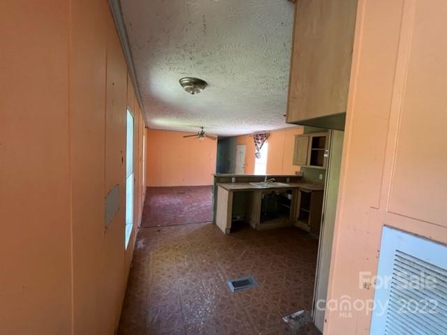 14 Fox Run Road Canton, NC 28716 - Photo 20 of 23 a view of kitchen with refrigerator and windows
