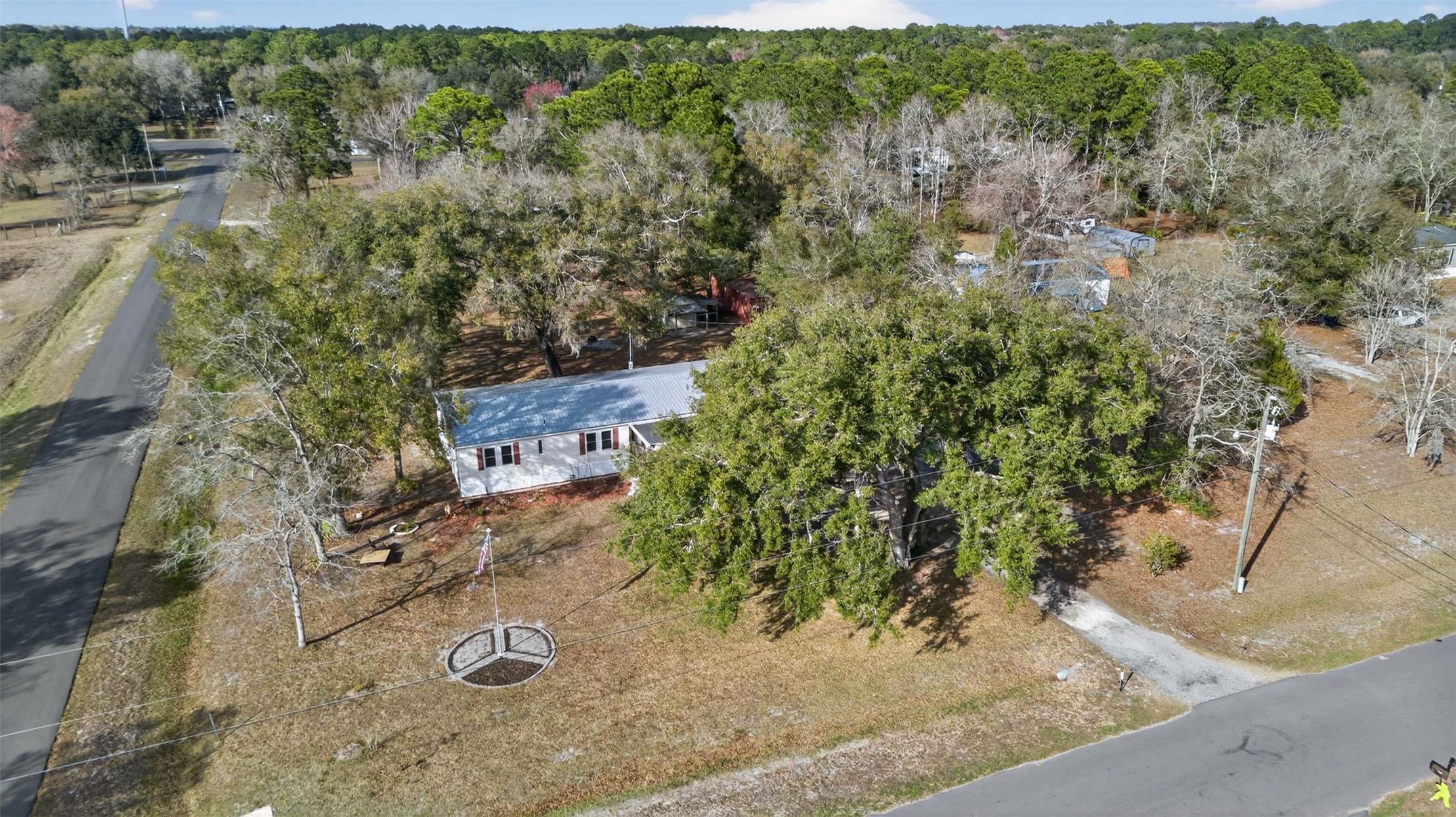 95021 Raintree Lane Fernandina Beach, FL 32034 - Photo 1 of 36 an aerial view of a house with a yard