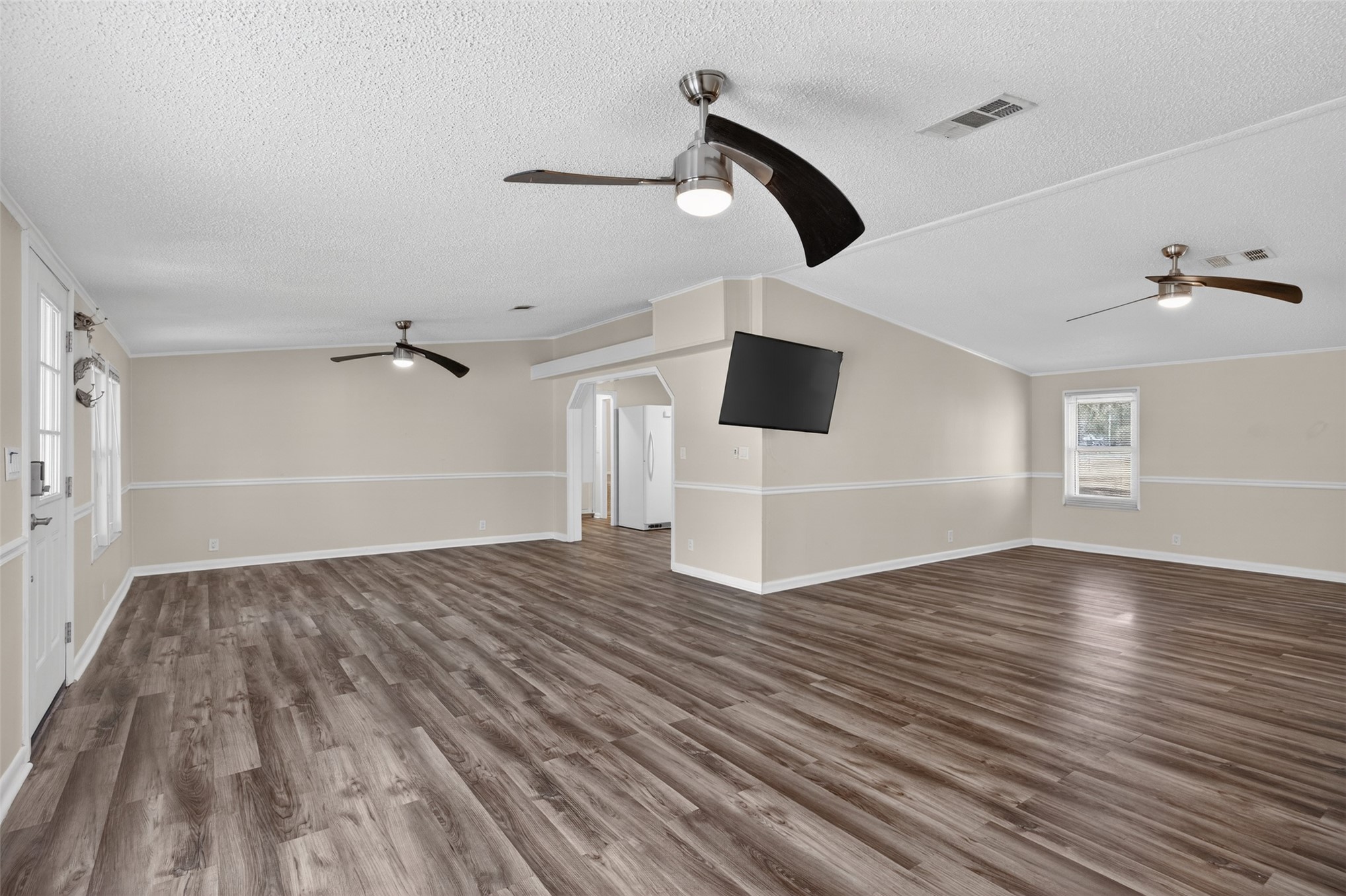 95021 Raintree Lane Fernandina Beach, FL 32034 - Photo 16 of 36 a view of empty room with wooden floor and fan