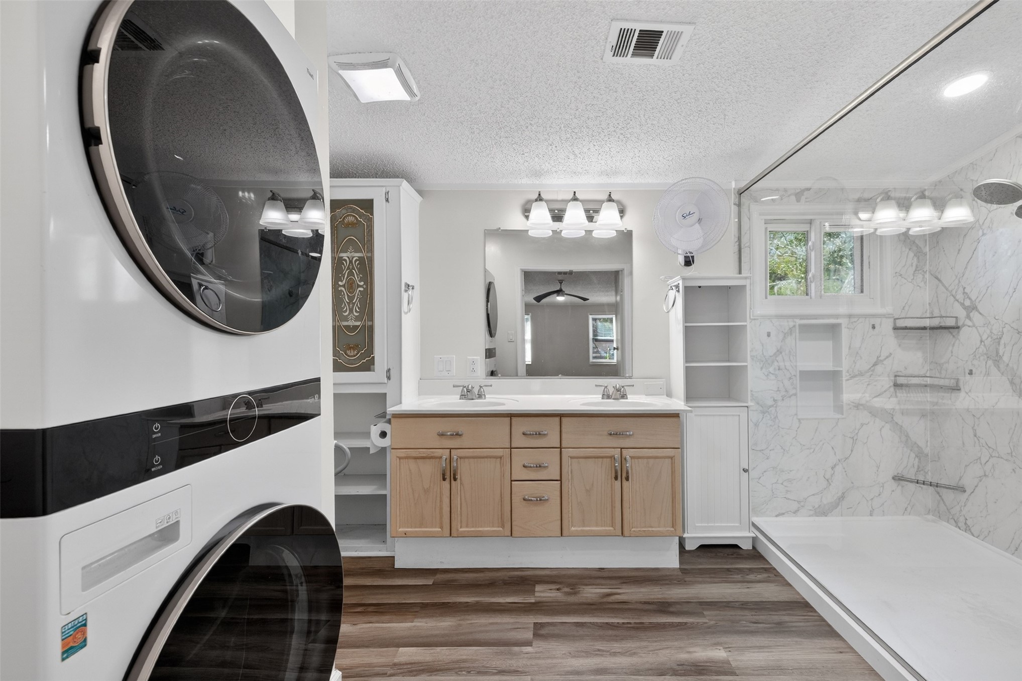95021 Raintree Lane Fernandina Beach, FL 32034 - Photo 19 of 36 a spacious bathroom with a sink a mirror and a shower