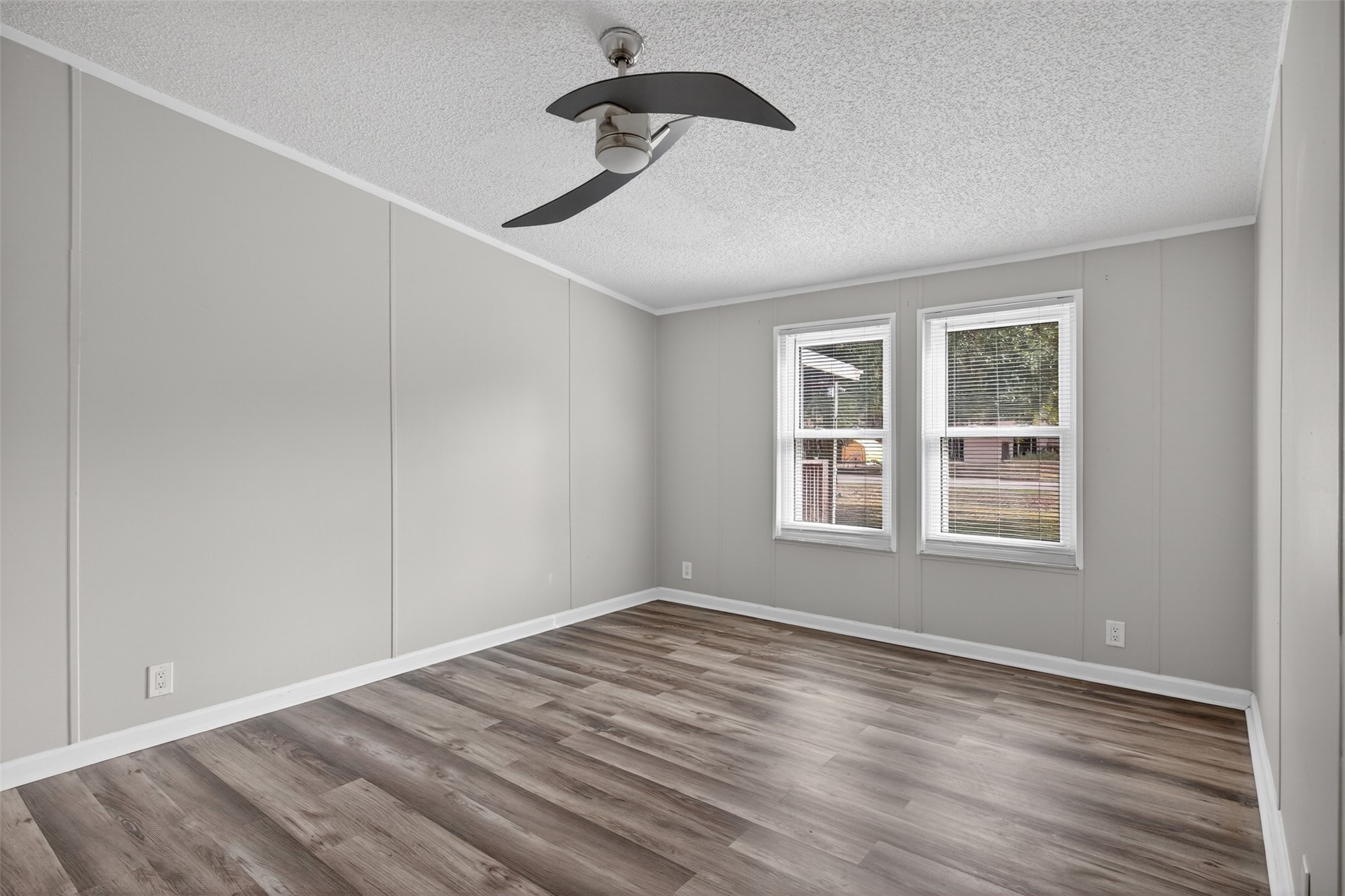 95021 Raintree Lane Fernandina Beach, FL 32034 - Photo 22 of 36 a view of empty room with wooden floor and fan