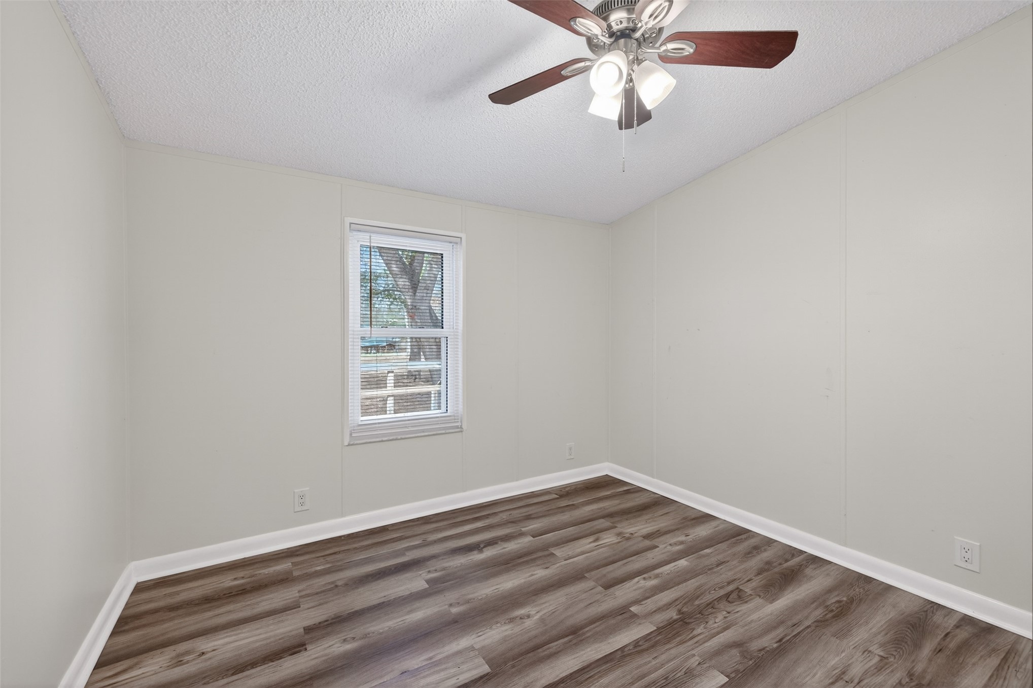 95021 Raintree Lane Fernandina Beach, FL 32034 - Photo 24 of 36 wooden floor in an empty room with a window