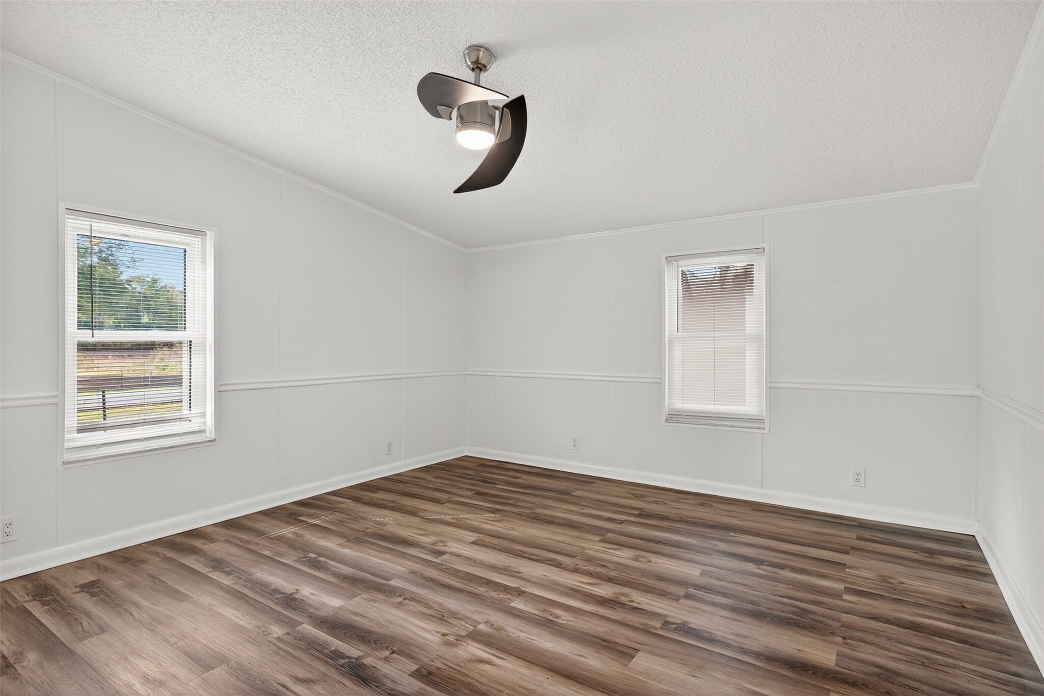 95021 Raintree Lane Fernandina Beach, FL 32034 - Photo 26 of 36 a view of empty room with wooden floor and fan