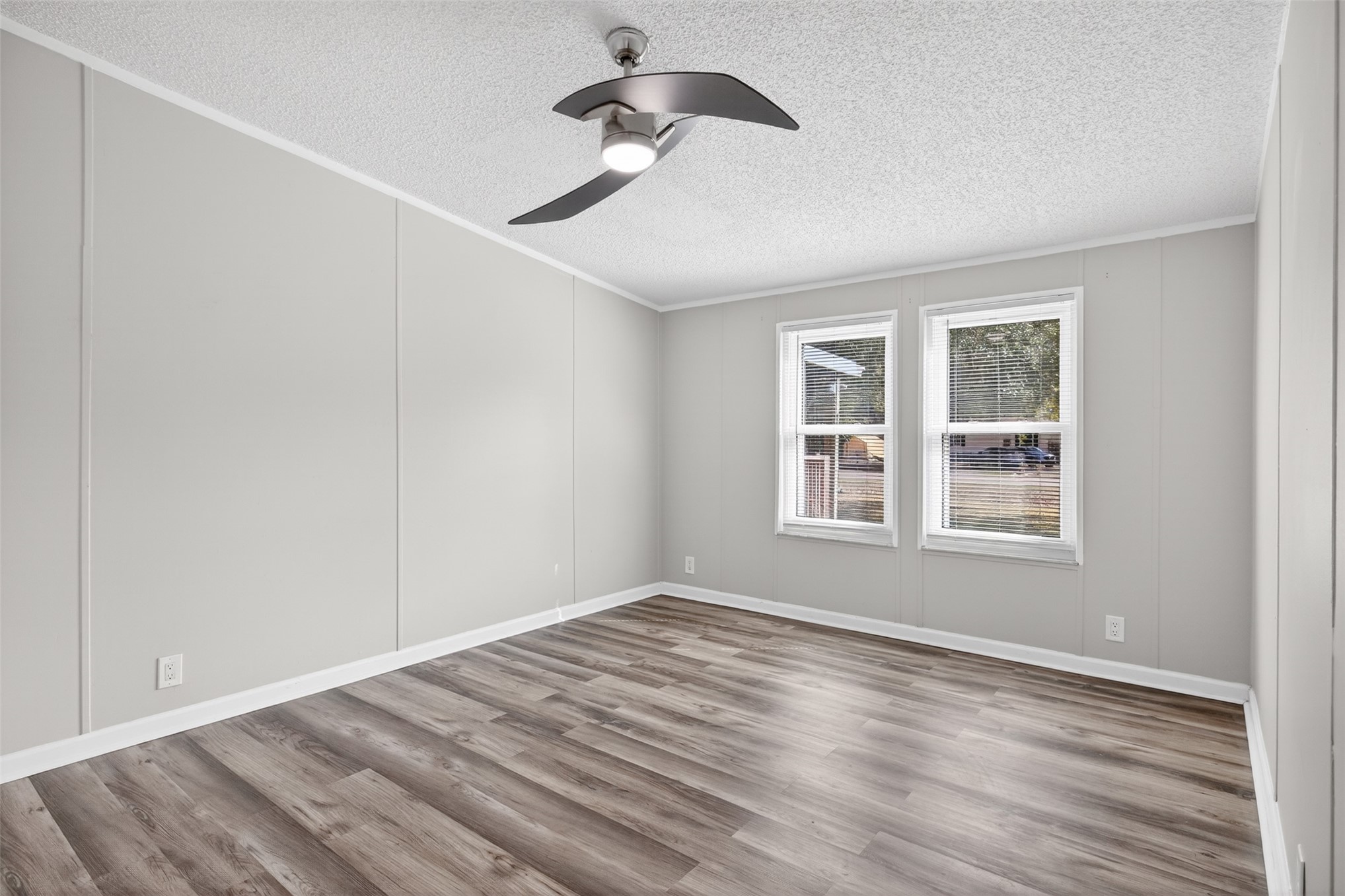95021 Raintree Lane Fernandina Beach, FL 32034 - Photo 27 of 36 a view of empty room with wooden floor and fan