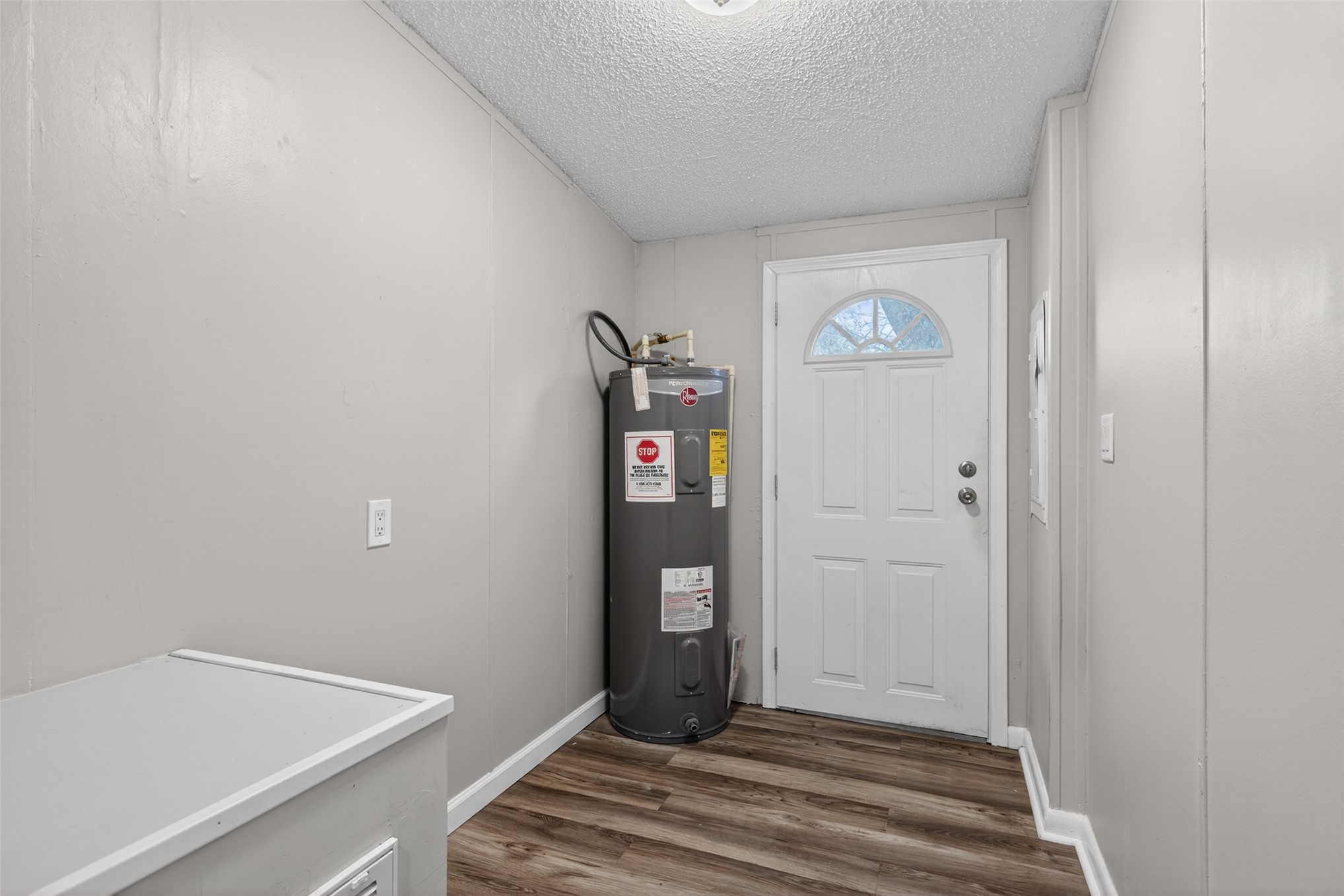 95021 Raintree Lane Fernandina Beach, FL 32034 - Photo 28 of 36 a view of a hallway with wooden floor and closet