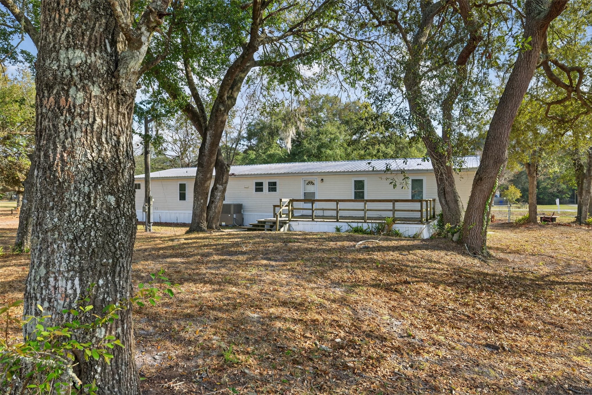 95021 Raintree Lane Fernandina Beach, FL 32034 - Photo 29 of 36 a view of a house with yard and tree s