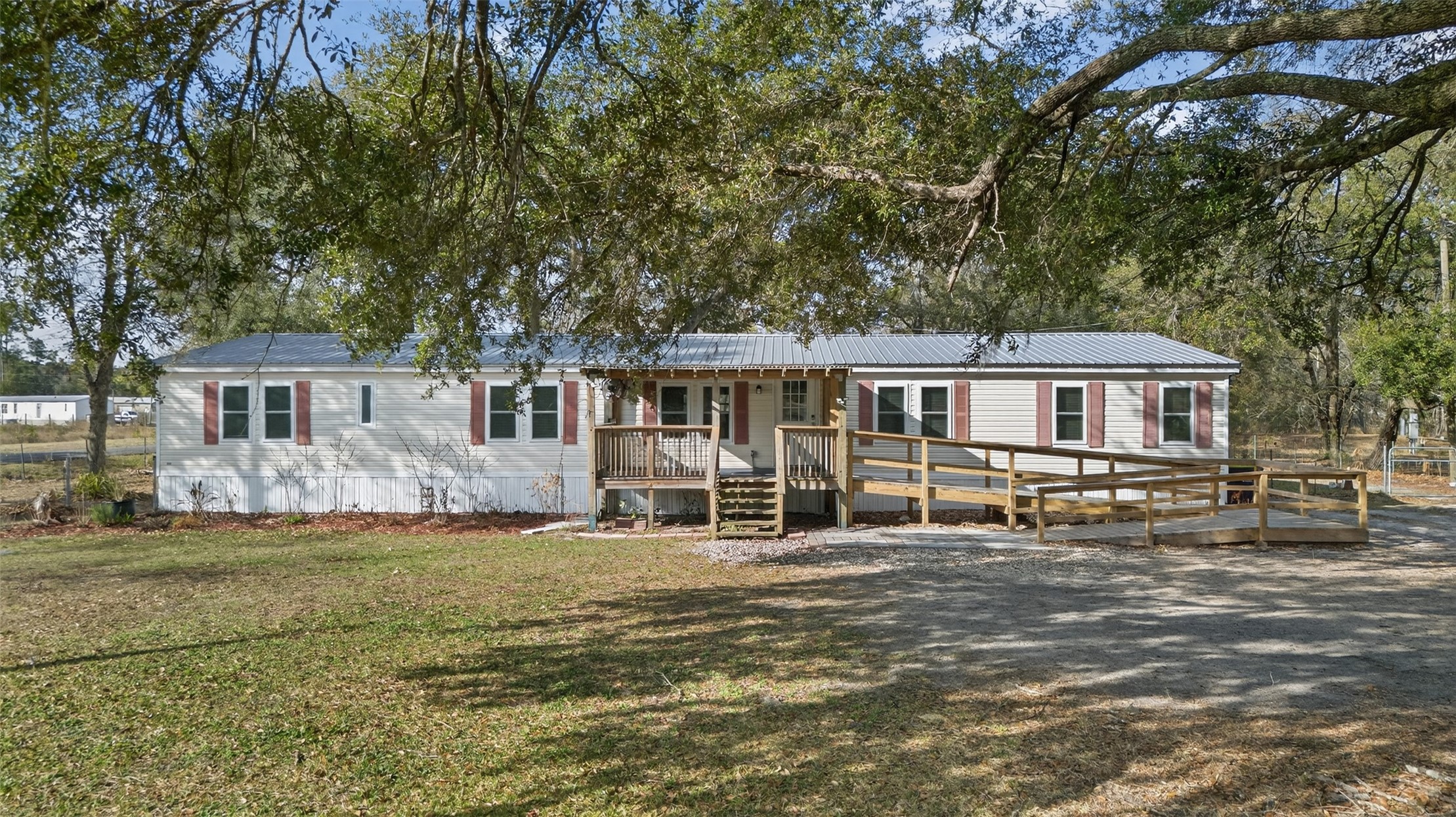 95021 Raintree Lane Fernandina Beach, FL 32034 - Photo 3 of 36 a front view of a house with a yard