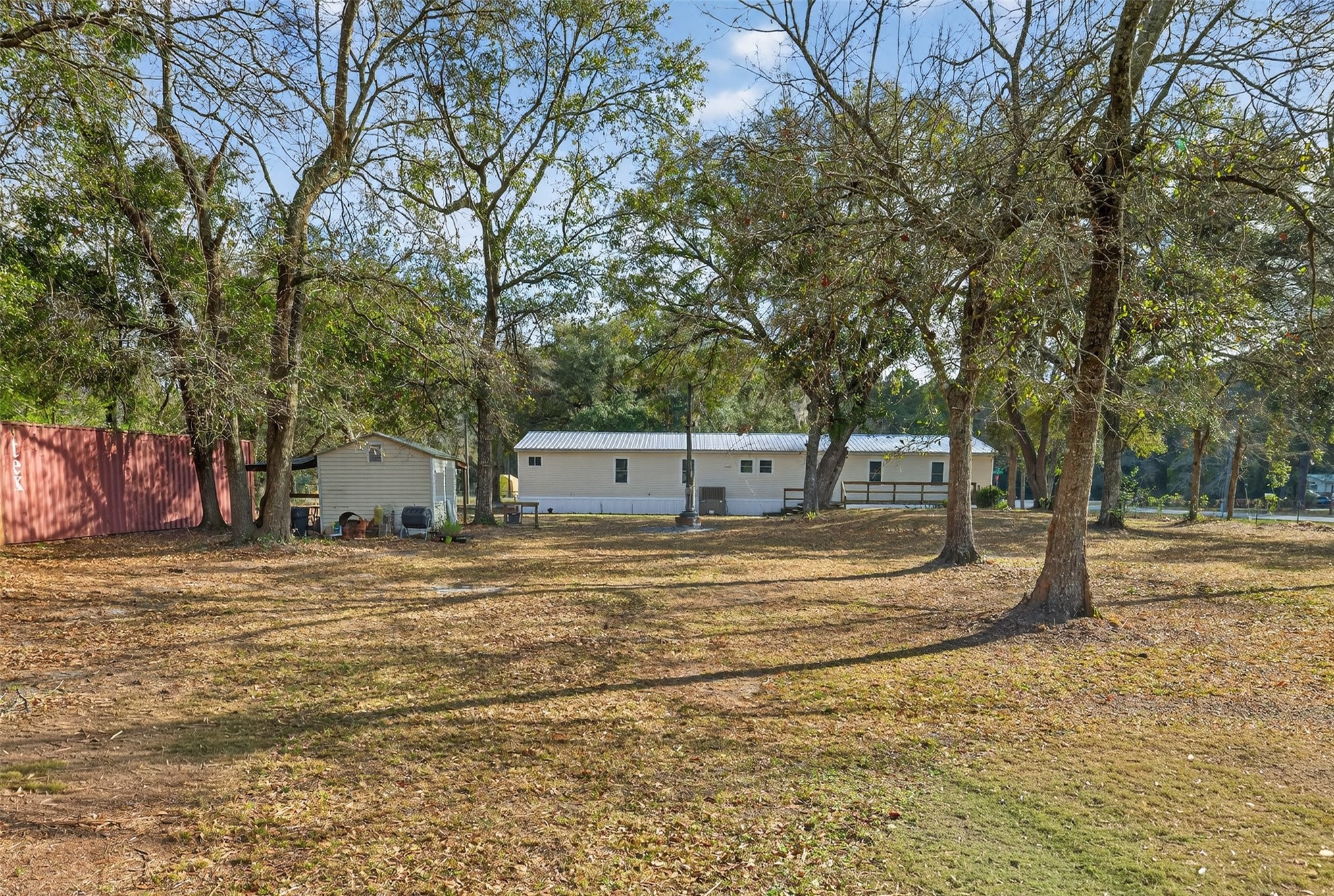 95021 Raintree Lane Fernandina Beach, FL 32034 - Photo 31 of 36 a house with trees in front of it