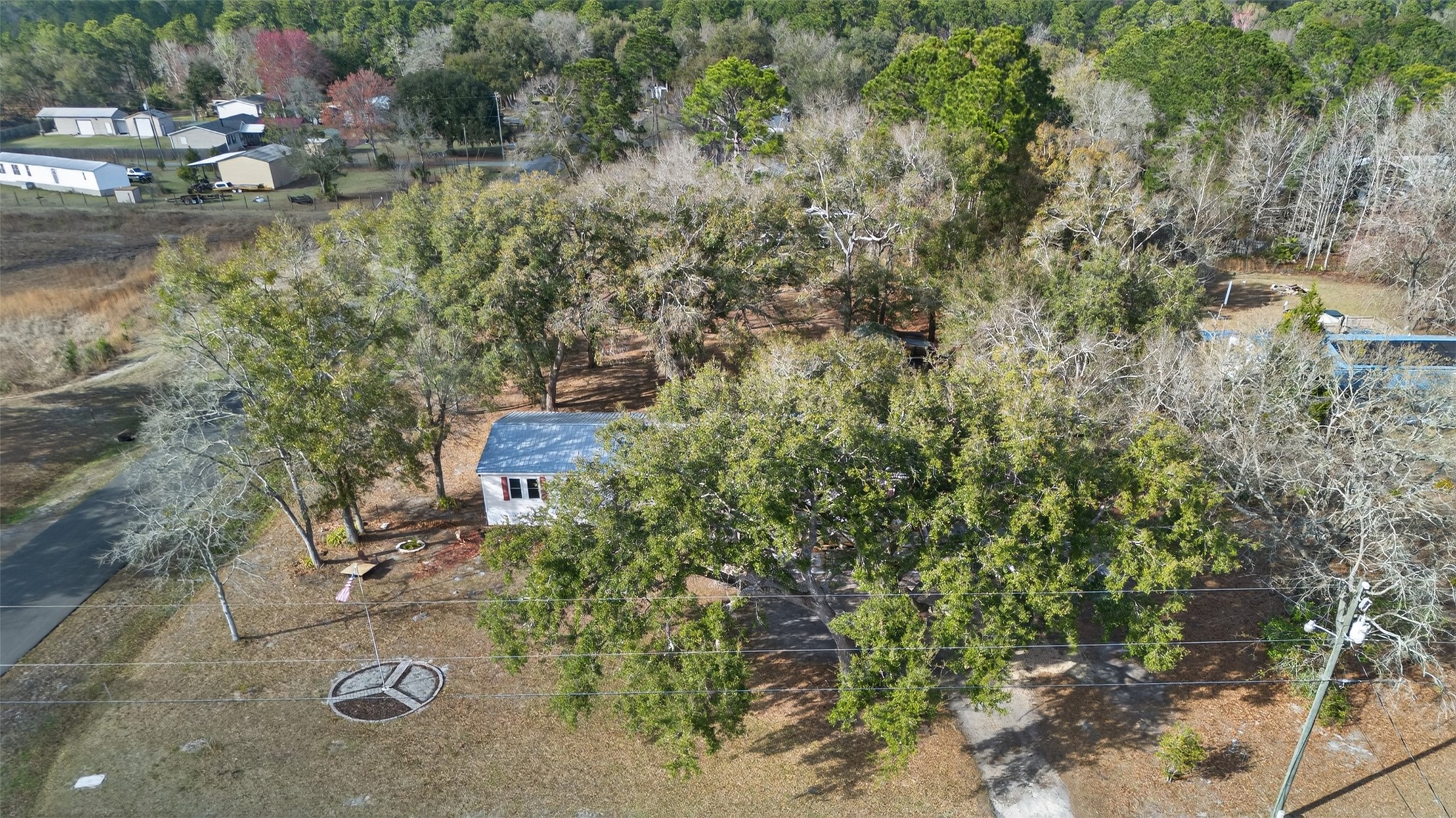 95021 Raintree Lane Fernandina Beach, FL 32034 - Photo 33 of 36 an aerial view of a house with a yard and lake view