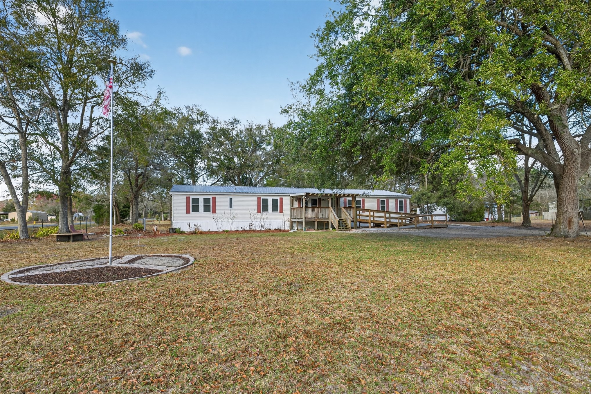 95021 Raintree Lane Fernandina Beach, FL 32034 - Photo 5 of 36 a front view of a house with garden