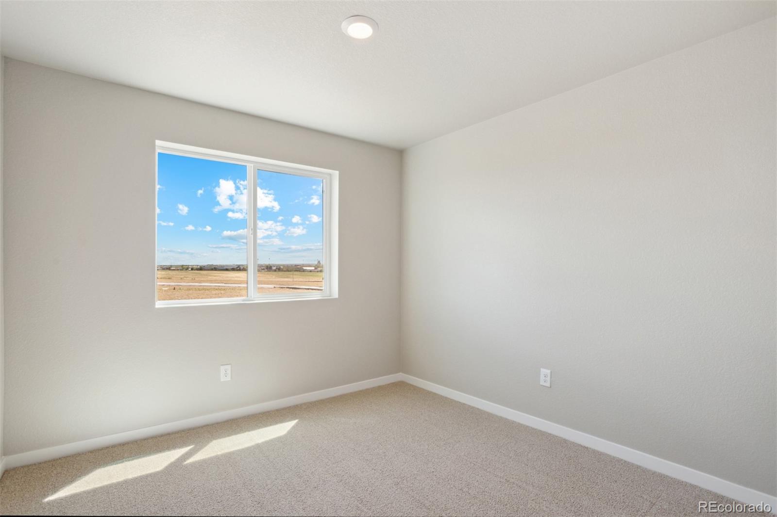 7416 Poudre Street Frederick, CO 80530 - Photo 13 of 30 an empty room with a window