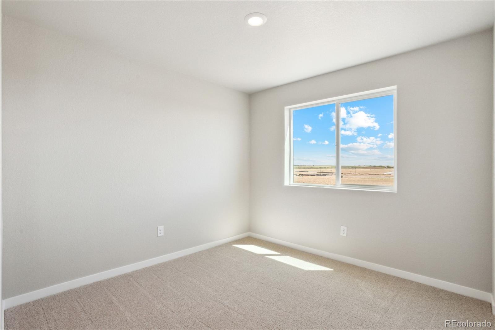 7416 Poudre Street Frederick, CO 80530 - Photo 14 of 30 an empty room with a window