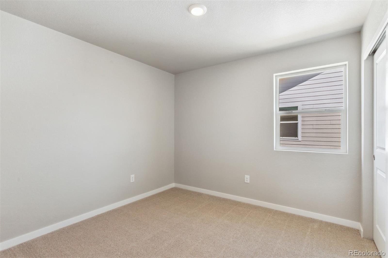 7416 Poudre Street Frederick, CO 80530 - Photo 15 of 30 an empty room with a window