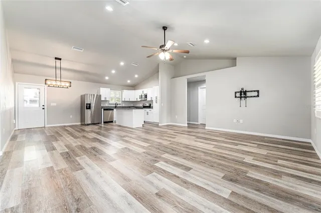a view of an empty room with a window