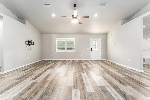 a view of an empty room with a window
