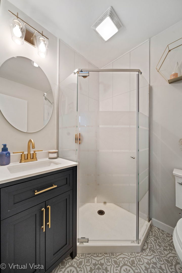 6367 Banburry Road, Unit 6367 Downers Grove, IL 60516 - Photo 13 of 20 a bathroom with a sink a toilet and a mirror