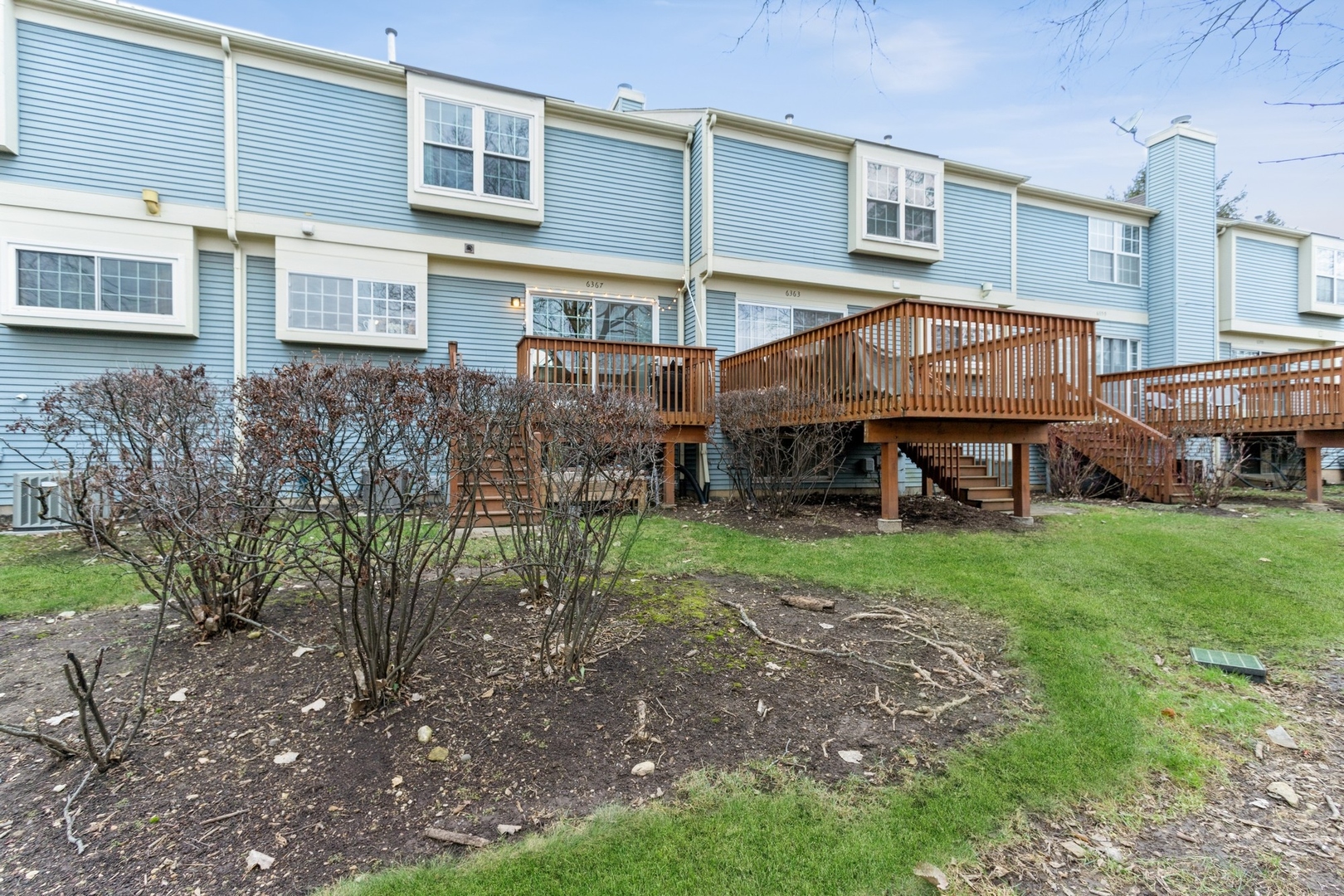 6367 Banburry Road, Unit 6367 Downers Grove, IL 60516 - Photo 18 of 20 a view of a house with a yard