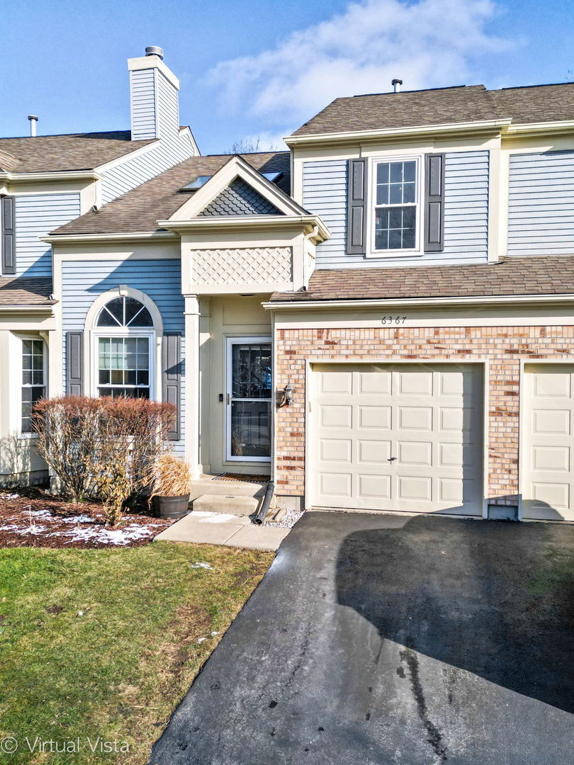 6367 Banburry Road, Unit 6367 Downers Grove, IL 60516 - Photo 2 of 20 a front view of a house with a yard