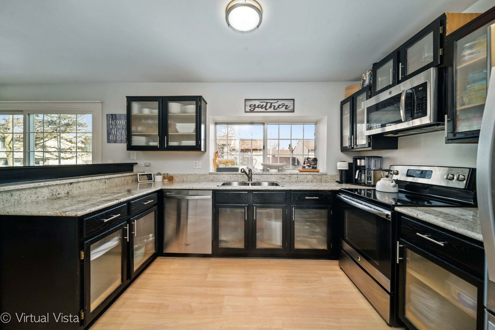 6367 Banburry Road, Unit 6367 Downers Grove, IL 60516 - Photo 6 of 20 a kitchen with stainless steel appliances granite countertop a stove and a sink