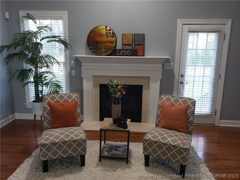 115 Blue Pine Drive Spring Lake, NC 28390 - Photo 11 of 48 a living room with furniture and a fireplace