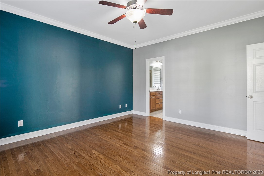 115 Blue Pine Drive Spring Lake, NC 28390 - Photo 18 of 48 wooden floor in an empty room with a window