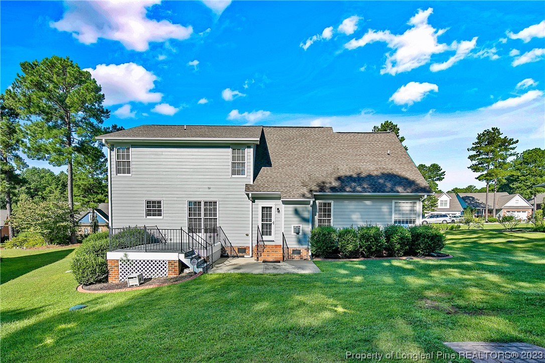 115 Blue Pine Drive Spring Lake, NC 28390 - Photo 37 of 48 a front view of house with yard and outdoor seating