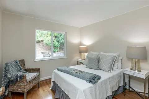 a bedroom with a bed and window