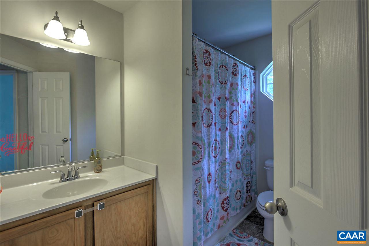 205 Jacoby Road Louisa, VA 23093 - Photo 13 of 21 a bathroom with a sink and a mirror
