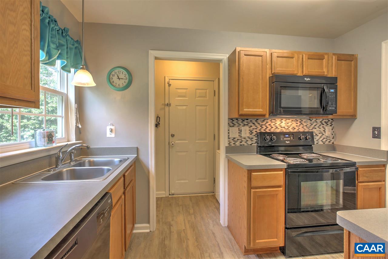 205 Jacoby Road Louisa, VA 23093 - Photo 5 of 21 a kitchen with a sink stove and microwave