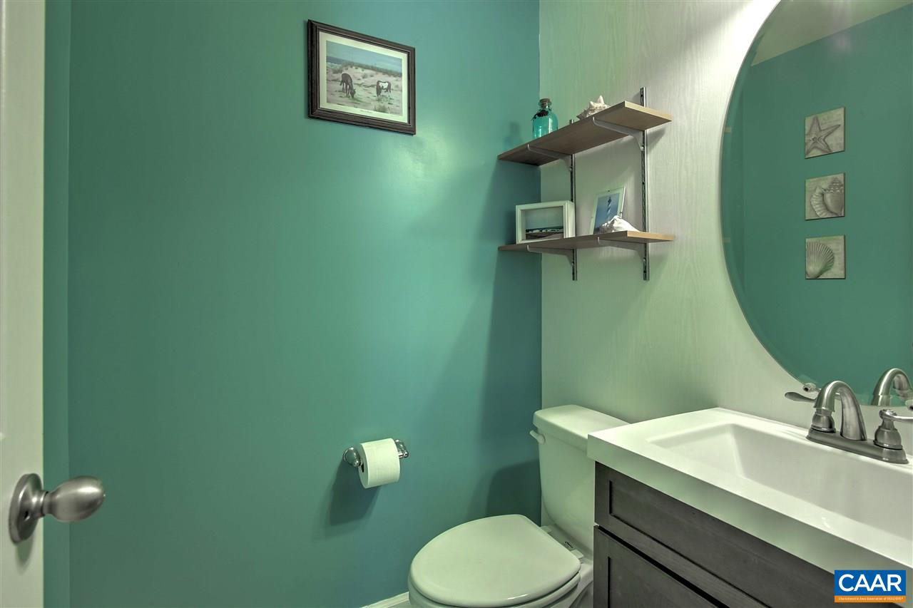 205 Jacoby Road Louisa, VA 23093 - Photo 9 of 21 a bathroom with a toilet sink and mirror