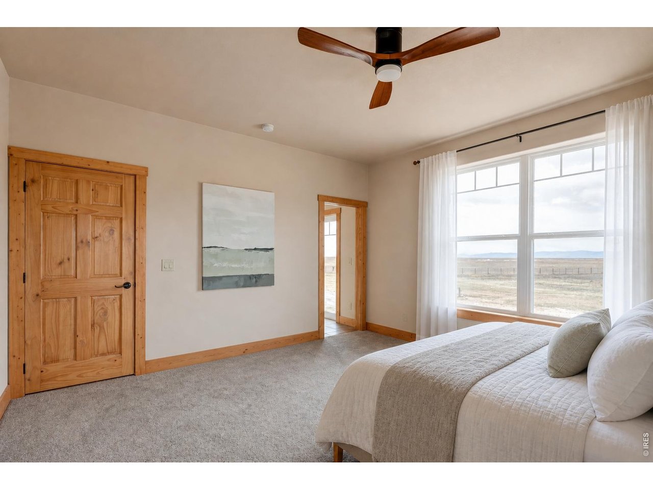 18298 Romar Ranch Road Carr, CO 80612 - Photo 21 of 49 a bedroom with a bed and window