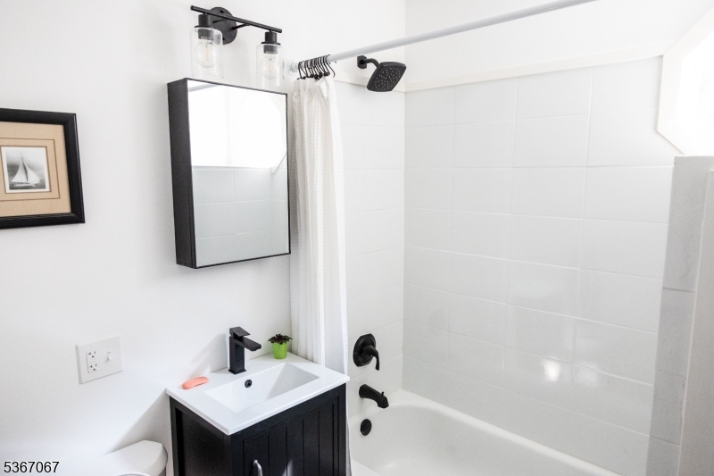 4 Bear Pond Trail Hopatcong, NJ 07821 - Photo 11 of 20 a bathroom with a sink and a mirror