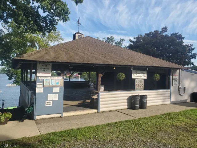 a front view of a house with parking area