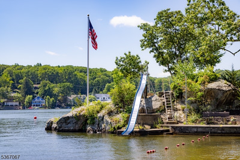 4 Bear Pond Trail Hopatcong, NJ 07821 - Photo 18 of 20 a view of a lake with boats and trees in the background