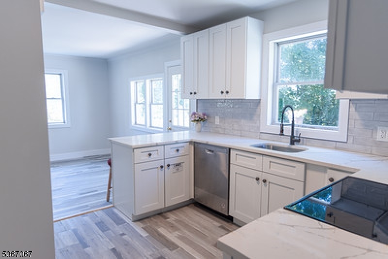 4 Bear Pond Trail Hopatcong, NJ 07821 - Photo 7 of 20 a kitchen with a sink cabinets appliances and a window