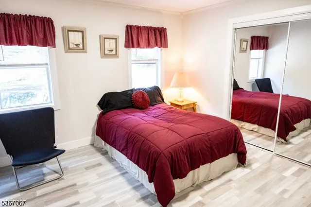 a bedroom with bed and a window