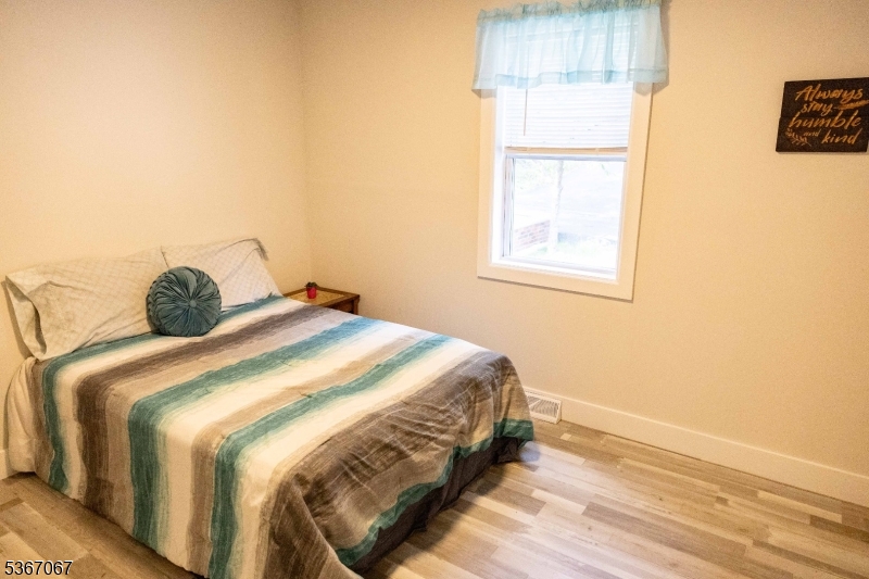 4 Bear Pond Trail Hopatcong, NJ 07821 - Photo 10 of 20 a bedroom with a bed and a window