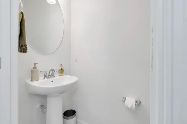 a bathroom with a sink and mirror