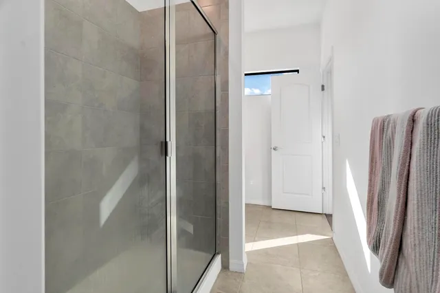 a bathroom with double vanity sinks and a mirror