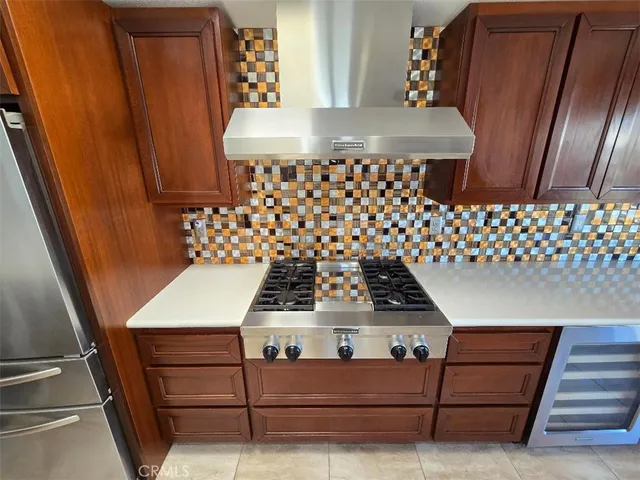 a close view of a stove top oven and cabinets