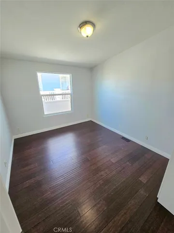 a spacious bathroom with a double vanity sink toilet mirror and bathtub