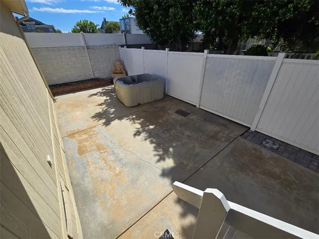 a bed with white sheets and pillows on it