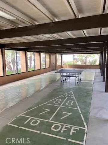 a view of a swimming pool with an outdoor seating