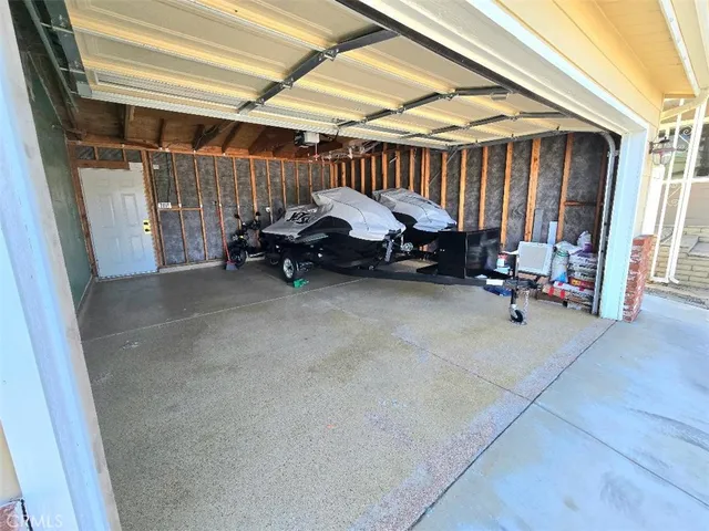 a view of a patio with table and chairs