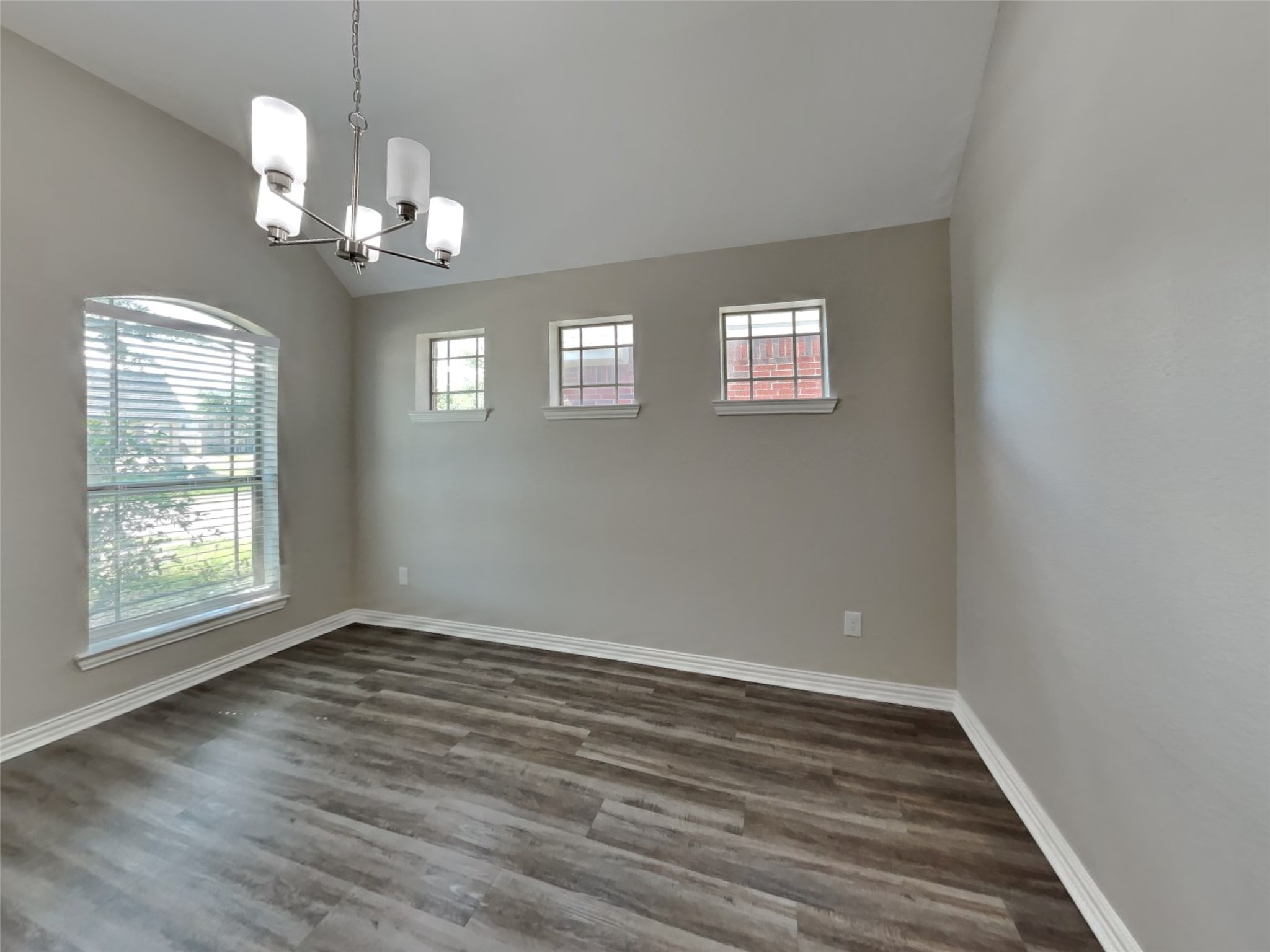 3007 Lockeridge Village Drive Spring, TX 77386 - Photo 6 of 18 a view of an empty room with wooden floor and a window