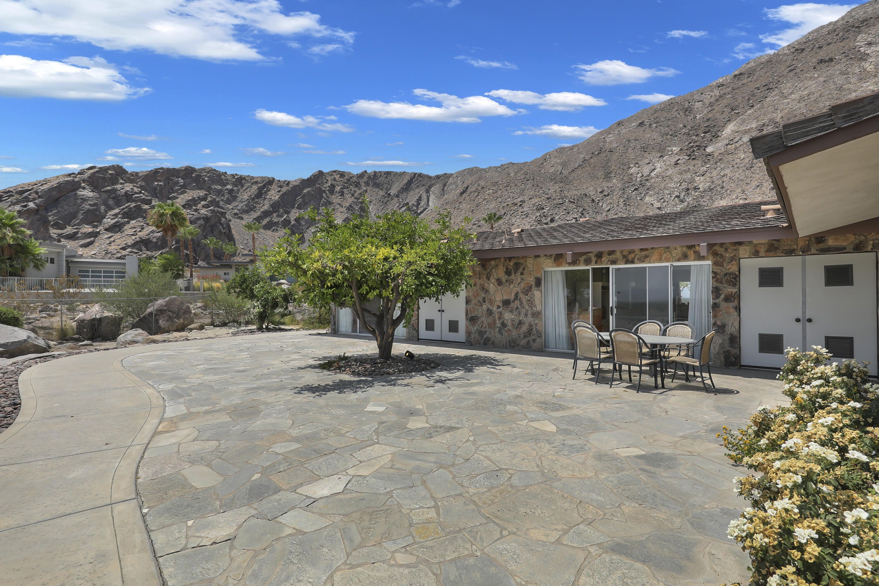 770 South La Mirada Road Palm Springs, CA 92264 - Photo 20 of 39 a view of a backyard with sitting area and garden