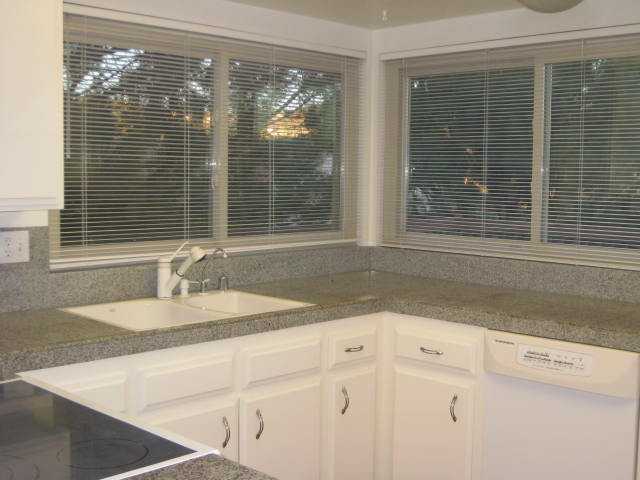 10085 El Capitan Real Road El Cajon, CA 92021 - Photo 9 of 25 This spacious kitchen is well-situated, just off dining and family rooms with easy access to outdoor deck