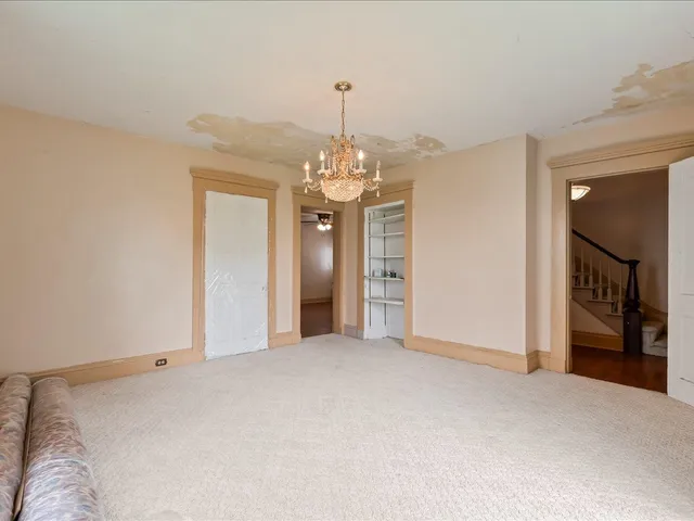 a big room with chandelier and entryway